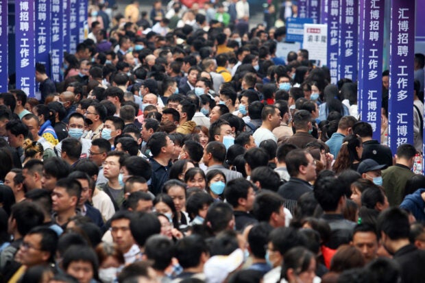 People attending a job fair in Chongqing, China