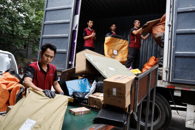 Packages unloaded from a truck ahead of the 618 shopping fest